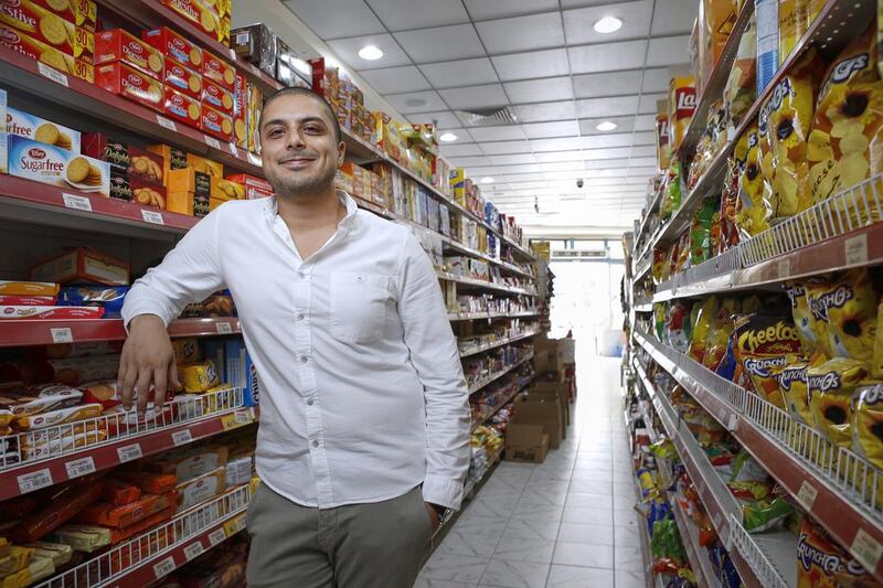 Taimoor Khan in the Save and Smile Hypermarket in Deira that he owns and operates. Antonie Robertson / The National