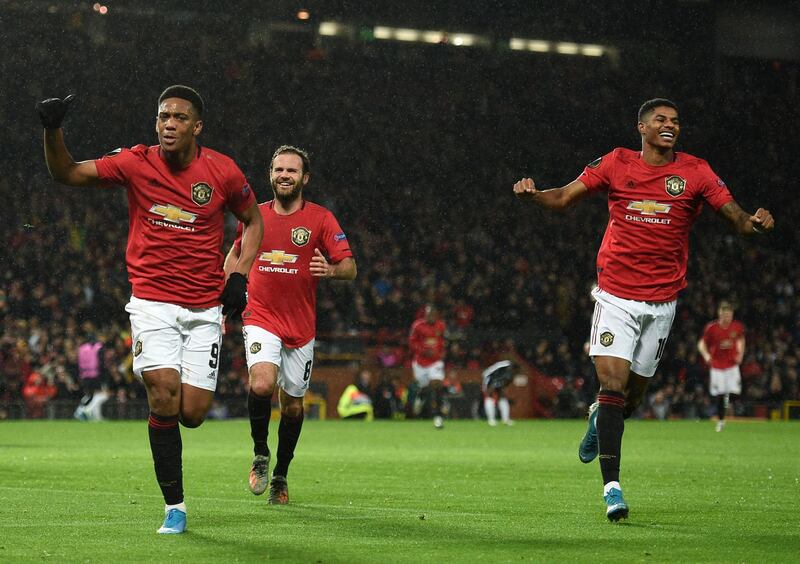 Manchester United's Anthony Martial, left, after scoring the second. AFP
