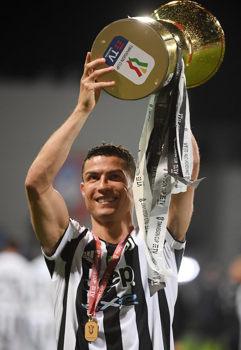 Cristiano Ronaldo celebrates with the trophy after winning the Coppa Italia. Reuters