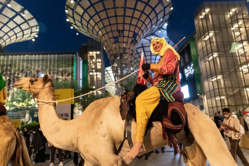 A camel trekker smiles on completing the journey.