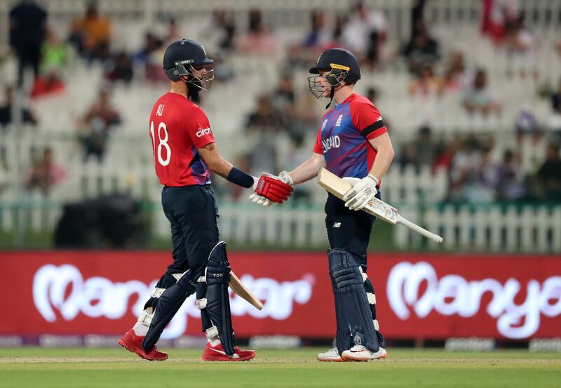 England's Moeen Ali celebrates his fifty against New Zealand at the Zayed Cricket Stadium in Abu Dhabi.