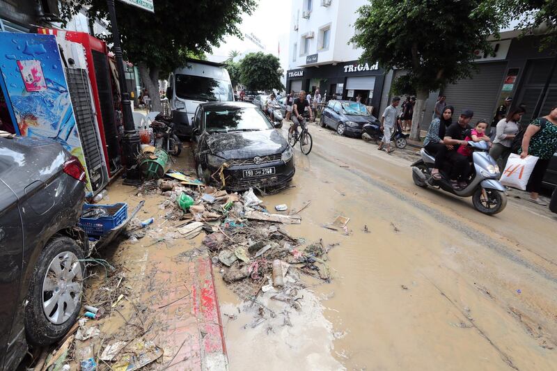 People look at damage caused by deadly flash flooding in the coastal town of Nabeul, Tunisia. EPA