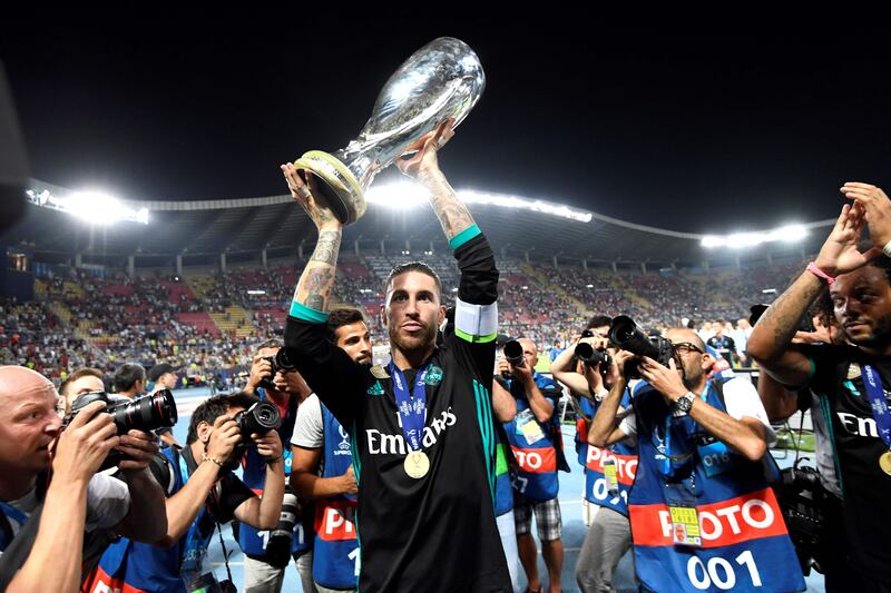 Real Madrid's Sergio Ramos holds the trophy after winning the UEFA Super Cup. Dimitar Dilkoff / AFP