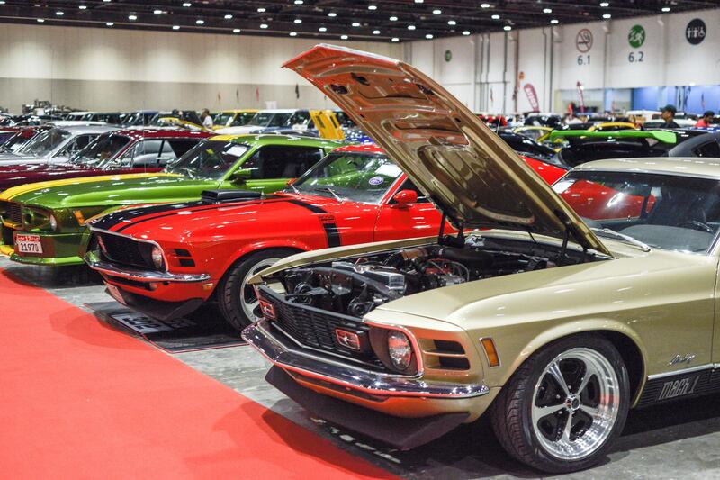 Abu Dhabi, United Arab Emirates -  Gold Ford Mustang, Mach 1, 1969 gold at the International Motor Show and Custom Show Emirates in Abu Dhabi National Exhibition Centre on April 5, 2018. (Khushnum Bhandari/ The National)