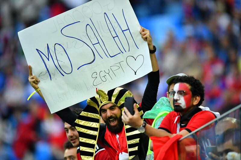 Egypt fans with a banner in reference to Mohamed Salah before the match. Dylan Martinez / Reuters