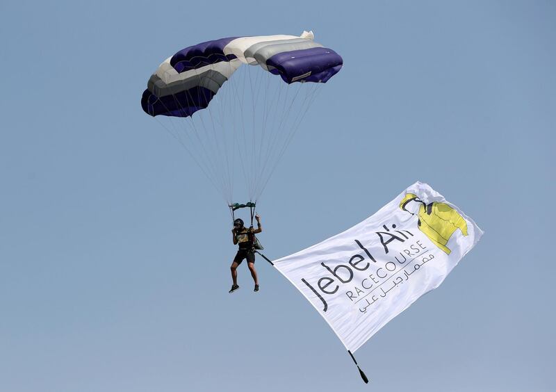 Dubai, United Arab Emirates - November 01, 2019: Skydivers land in the parade ring on the opening meeting at Jebel Ali racecourse. Friday the 1st of November 2019. Jebel Ali racecourse, Dubai. Chris Whiteoak / The National