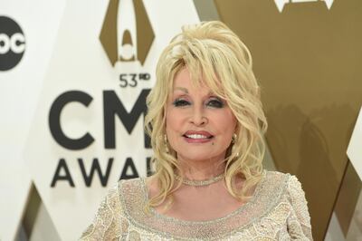 File-This Nov. 13, 2019, file photo shows Dolly Parton arriving at the 53rd annual CMA Awards at Bridgestone Arena in Nashville, Tenn. Parton's new Netflix series "Heartstrings" will tell a host of stories when it premieres on Friday. One will put the spotlight on Parton's home and people in the mountains of East Tennessee. The series debuts on the streaming platform with eight episodes each telling a story based on one of Parton's songs.(Photo by Evan Agostini/Invision/AP, File)