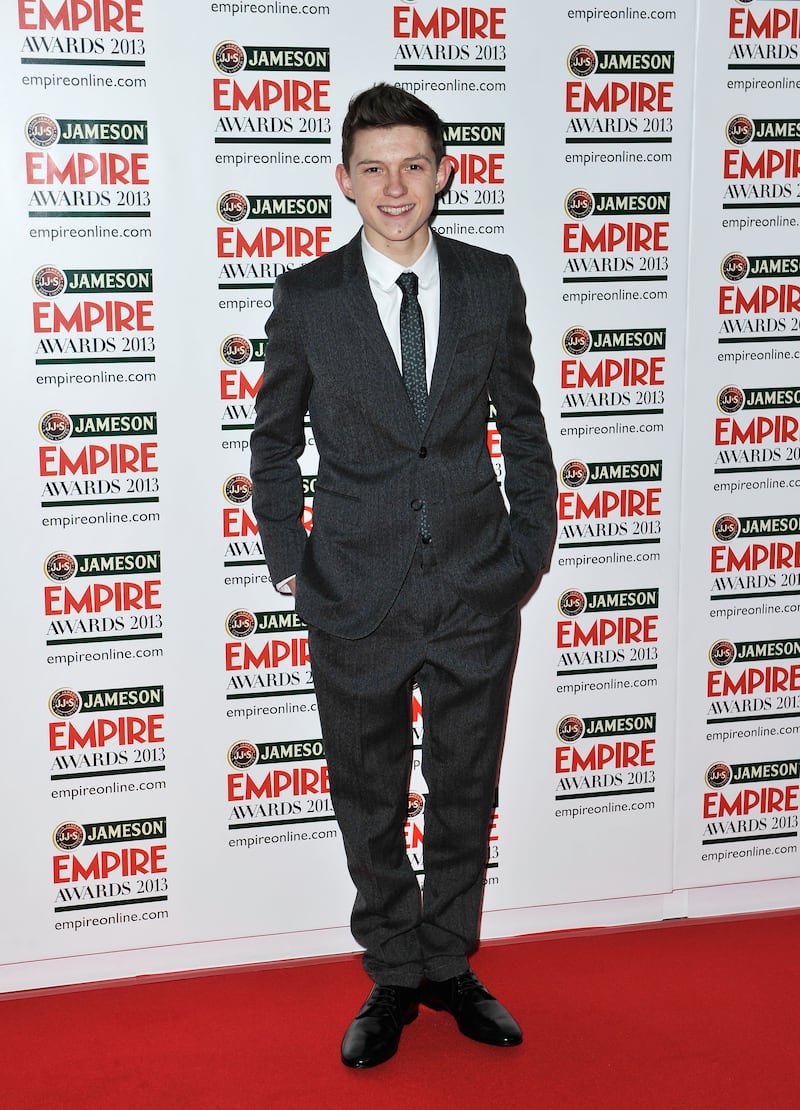 Tom Holland, in a grey wool suit, arrives at the Jameson Empire Awards at Grosvenor House on March 24, 2013 in London. Getty Images