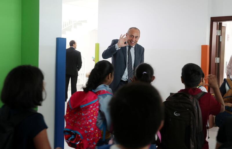 DUBAI ,  UNITED ARAB EMIRATES , SEPTEMBER 11 – 2019 :- James Lynch , Principal saying good bye to the students after the school break at the Ambassador International Academy in Al Khail Gate , Al Quoz  in Dubai. ( Pawan Singh / The National ) For News. Story by Anam