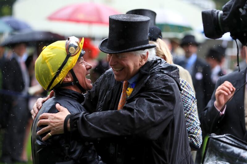 Jockey Frankie Dettori and qwner Evelyn de Rothschild celebrate after the Italian won the Prince of Wales's Stakes with Crystal Ocean. Press Association