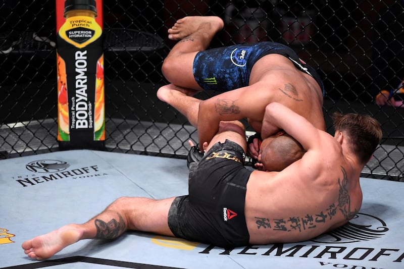 LAS VEGAS, NEVADA - AUGUST 15: (L-R) Daniel Cormier takes down Stipe Miocic in their UFC heavyweight championship bout during the UFC 252 event at UFC APEX on August 15, 2020 in Las Vegas, Nevada. (Photo by Chris Unger/Zuffa LLC)