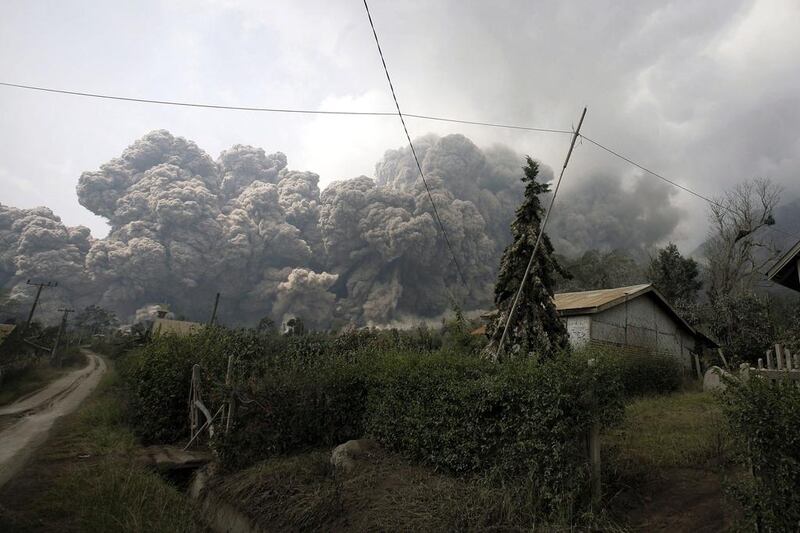 The volcano on the western island of Sumatra started erupting in September but on Saturday spewed hot rocks and ash 2,000 metres (16,00 feet) into the air, blanketing the surrounding countryside with grey dust. Chaideer Mahyuddin / AFP Photo 