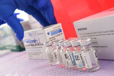 Bottles of the single-dose Johnson & Johnson Covid-19 vaccine await transfer into syringes for administering at a vaccination locatoin in Los Angeles. AFP