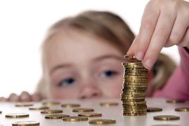 According to studies, children as young as 5 are already able to grasp the basics of money and that it is needed to buy things. istockphoto.com