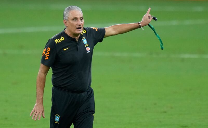 Brazil coach Tite gives instructions to his players. AP Photo