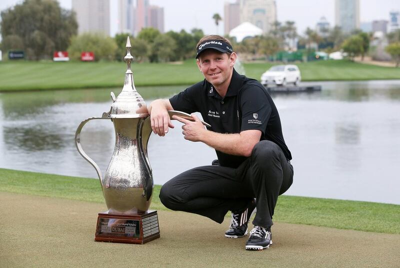 Stephen Gallacher is having trouble finding space for his trophies after winning the past two Dubai Desert Classic titles. He covets a third coffee pot trophy, nonetheless. Pawan Singh / The National