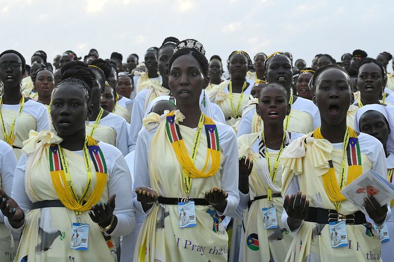 Members of the choir sing. AFP