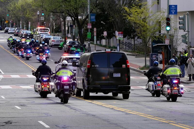 A procession accompanies a vehicle carrying the body of police officer William Evans, killed after a car rammed into two officers at a barricade outside the US Capitol. AP Photo