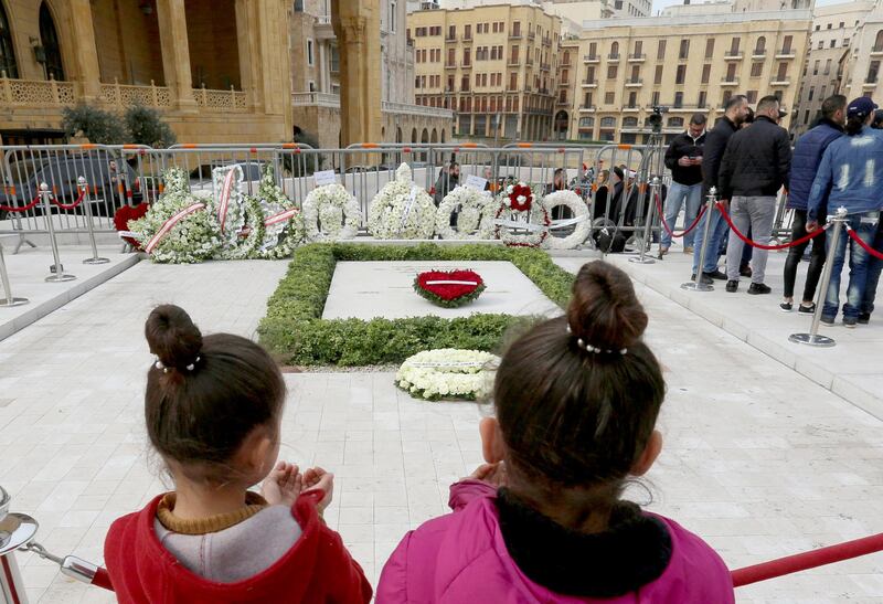 Girls pray at the grave of former Lebanese prime minister Rafik al-Hariri, marking the 15th anniversary of his assassination, in downtown Beirut, Lebanon. Reuters