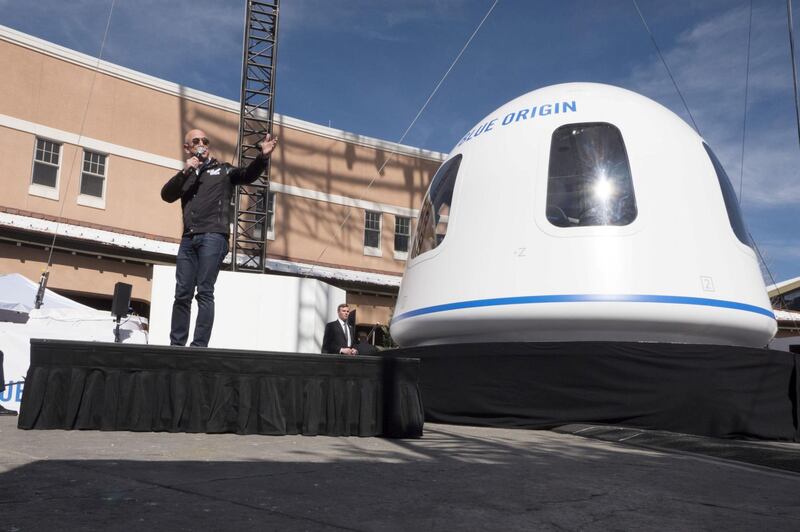 Jeff Bezos, chief executive officer of Amazon.com Inc. and founder of Blue Origin LLC, speaks at the unveiling of the Blue Origin New Shepard system during the Space Symposium in Colorado Springs, Colorado, U.S., on Wednesday, April 5, 2017. Bezos has been reinvesting money he made at Amazon since he started his space exploration company more than a decade ago, and has plans to launch paying tourists into space within two years. Photographer: Matthew Staver/Bloomberg