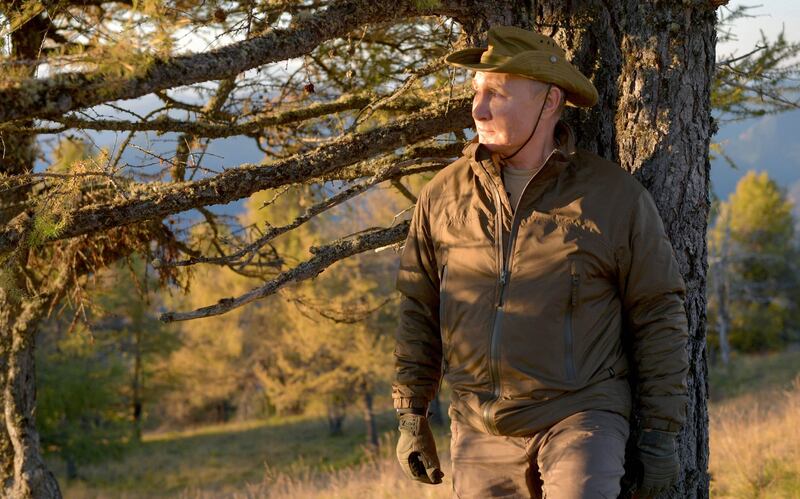 President Vladimir Putin stops during a walk in the Siberian taiga. AFP