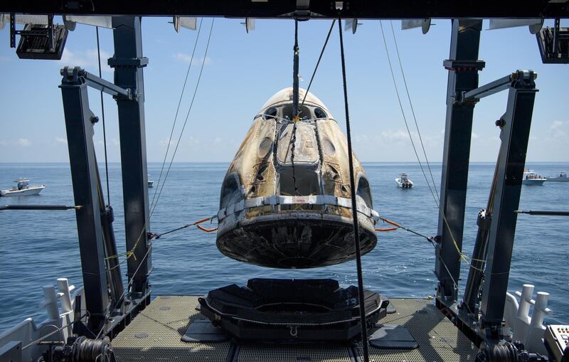 The SpaceX Crew Dragon Endeavour spacecraft is lifted onto the SpaceX GO Navigator recovery ship shortly after it landed. REUTERS