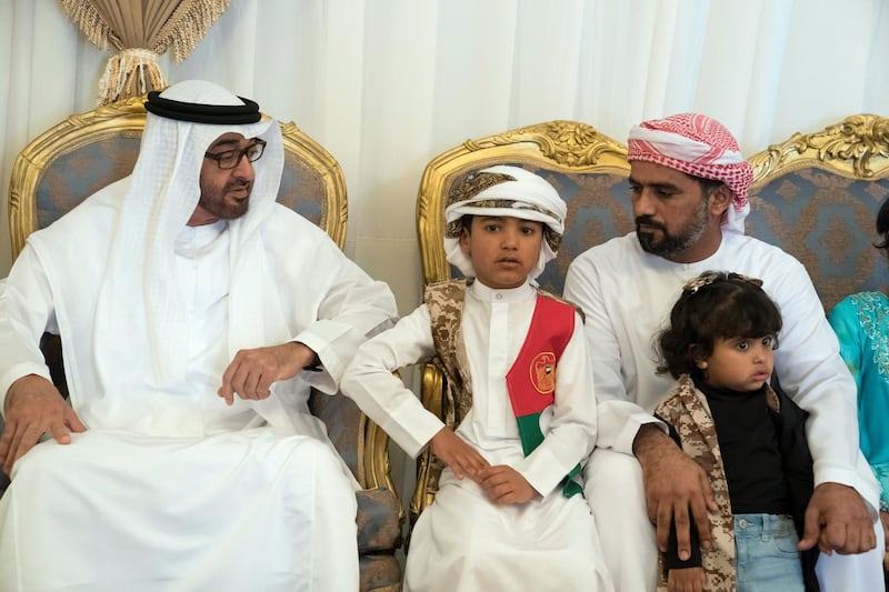 RAS AL KHAIMAH, UNITED ARAB EMIRATES -January 26, 2018: HH Sheikh Mohamed bin Zayed Al Nahyan Crown Prince of Abu Dhabi Deputy Supreme Commander of the UAE Armed Forces (L), offers condolences to the family of martyr Abdullah Al Dahmani, who passed away while serving the the UAE Armed Forces in Yemen. 

( Hamad Al Kaabi / Crown Prince Court - Abu Dhabi )

---