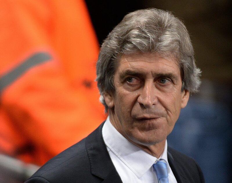 Manuel Pellegrini and Manchester City face a 2-0 deficit for the second leg in Barcelona. Peter Powell / EPA  