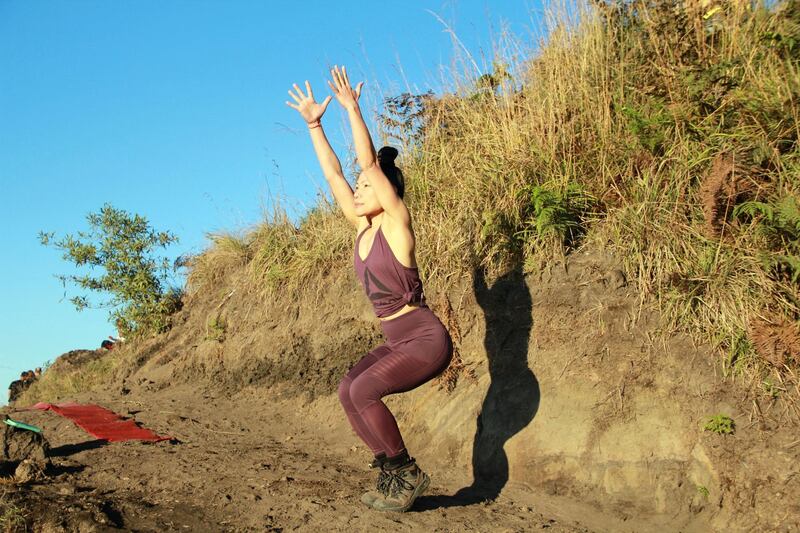 Chair pose. This pose strengthens the core, quads and glutes, builds the muscles and tendons around the knees, stretches the calves, top of the feet and ankles, and promotes balance. Courtesy Nerry Toledo