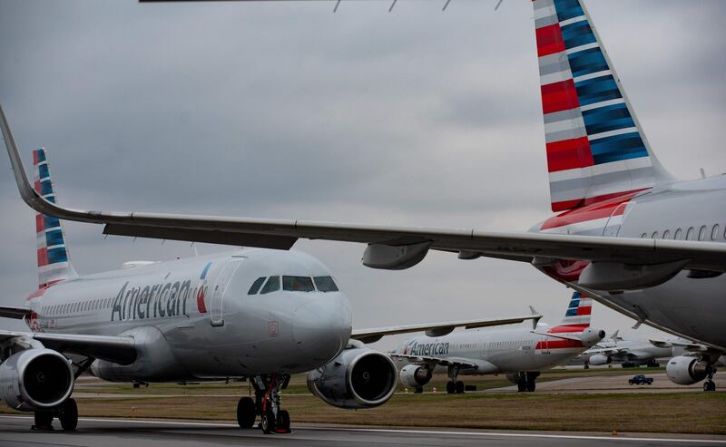 (FILES) In this file photo taken on March 27, 2020, jets are parked on runway 28 at the Pittsburgh International Airport in Pittsburgh, Pennsylvania.  US Treasury Secretary Steven Mnuchin and major US airlines reached an agreement on April 14, 2020, on aid to pay workers and avoid bankruptcies in an industry that employs 750,000 people amid the coronavirus pandemic. / AFP / GETTY IMAGES NORTH AMERICA / JEFF SWENSEN
