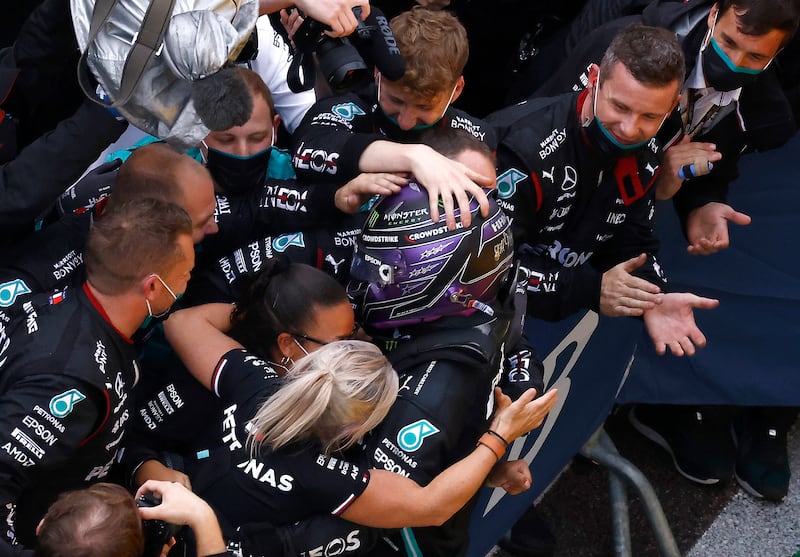 Hamilton celebrates with his Mercedes teammates after winning the 2021 Russian Grand Prix in Sochi. Reuters