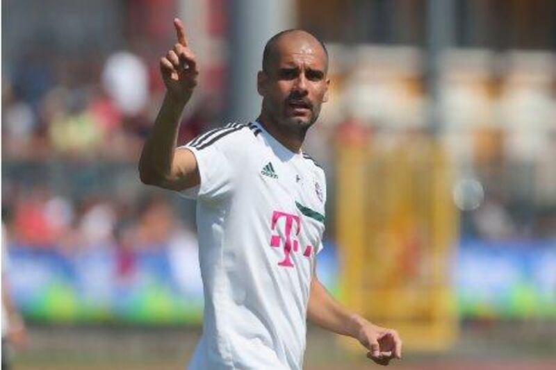 Bayern Munich coach Pep Guardiola gestures during a training session this week. Alexander Hassenstein / Getty Images