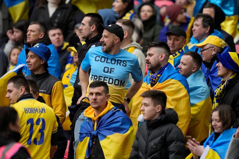 Ukrainian fans before the kick-off at Wembley. AP