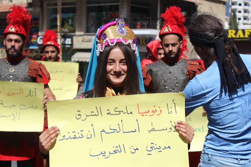 Pro-democracy protesters in Syria's Suweida wear costumes depicting queen Zenobia, a third century Syrian desert ruler, and her troops, who defied Roman rule. Photo: Suwayda 24