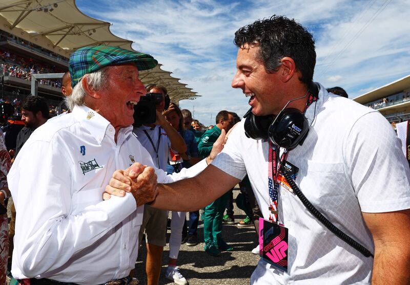 Sir Jackie Stewart with Rory McIlroy on the grid during the United States GP. AFP