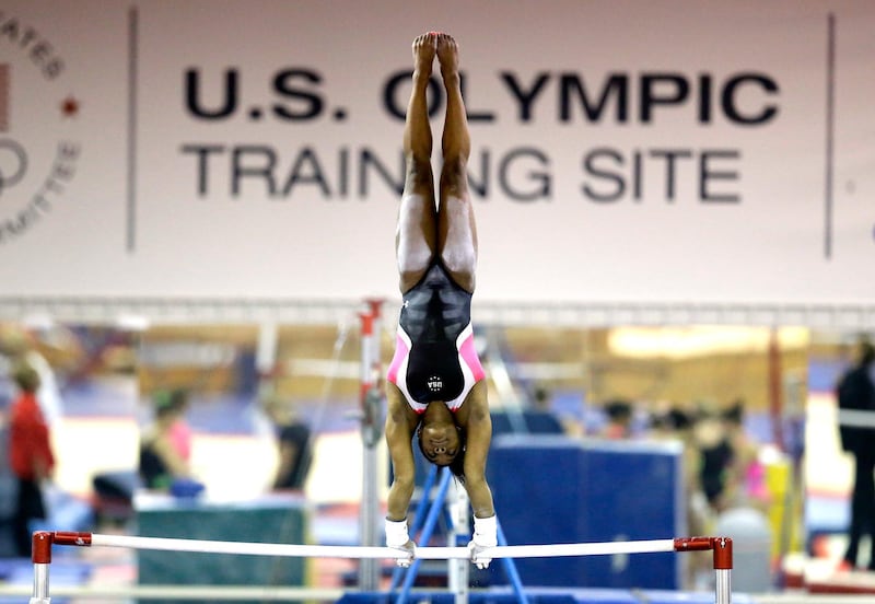 FILE - In this Sept. 12, 2015, file photo, U.S. gymnast Simone Biles trains at the Karolyi Ranch in New Waverly, Texas. Biles has met the new president of USA Gymnastics but hasn't heard from the U.S. Olympic Committee regarding the Larry Nassar sexual abuse scandal. The four-time gold medalist at the Rio Games is training for the 2020 Tokyo Olympics.  (AP Photo/David J. Phillip, File)
