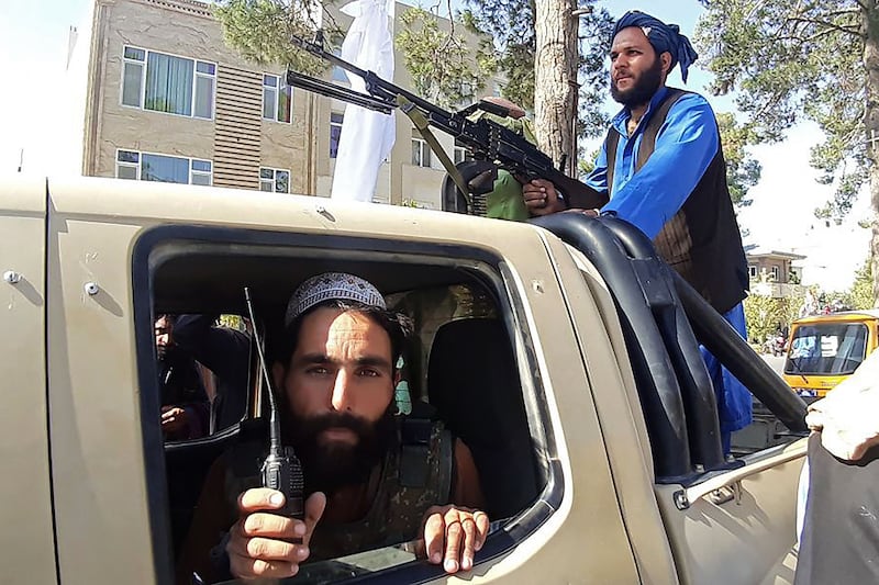 Taliban fighters in Herat. The US and UK have told their citizens to leave Afghanistan. The insurgents have also taken Pul-e-Alam in Logar province, just 50km south of Kabul.