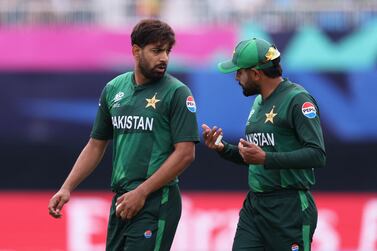 NEW YORK, NEW YORK - JUNE 11: Babar Azam and Haris Rauf of Pakistan interact during the ICC Men's T20 Cricket World Cup West Indies & USA 2024 match between Pakistan and Canada at Nassau County International Cricket Stadium on June 11, 2024 in New York, New York.    Robert Cianflone / Getty Images / AFP (Photo by ROBERT CIANFLONE  /  GETTY IMAGES NORTH AMERICA  /  Getty Images via AFP)