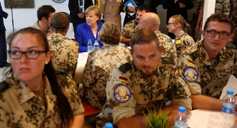 German Chancellor Angela Merkel talks with German soldiers stationed in Jordan, June 21, 2018. REUTERS/Muhammad Hamed