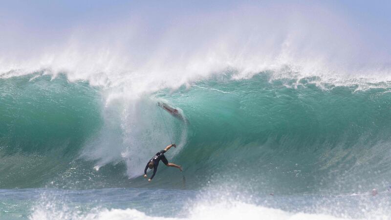A surfer falls into the water at Pipeline on the North Shore of Oahu, Hawaii on Saturday, May 1. AFP
