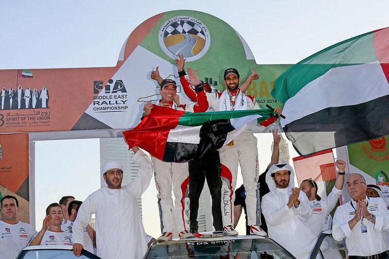 Sheikh Khalid, right, celebrates after winning the Dubai International Rally. Photo by Bob McCaffrey