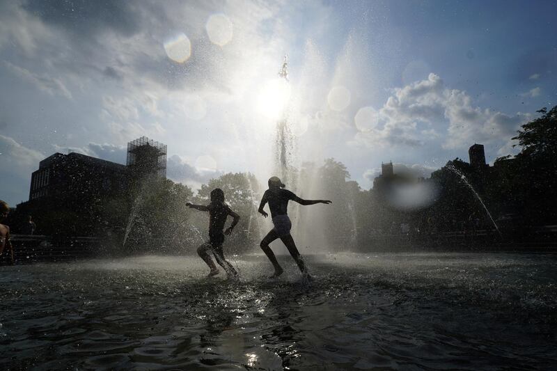 Children play in the fountain at Washington Square Park during hot weather in Manhattan, New York, US. Reuters