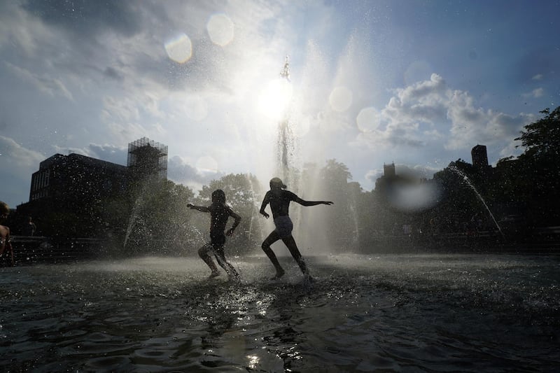 Children play in the fountain at Washington Square Park during hot weather in Manhattan, New York, US. Reuters