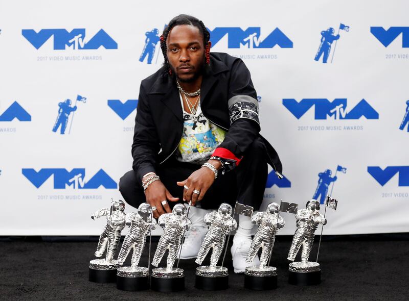 Kendrick Lamar with his awards. Danny Moloshok / Reuters