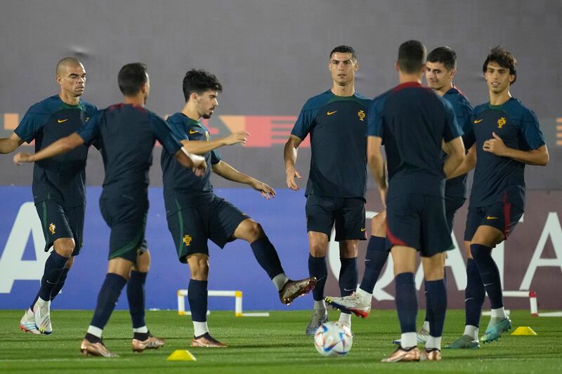 Portugal's Cristiano Ronaldo, centre, warms up with Portugal teammates. AP