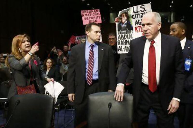 Protesters disrupt proceedings as John Brennan arrives to testify before a Senate Intelligence Committee hearing on his nomination to be the director of the CIA.