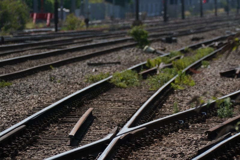 Train tracks are painted white to help with the heat at Alexandra Palace train station in London. PA