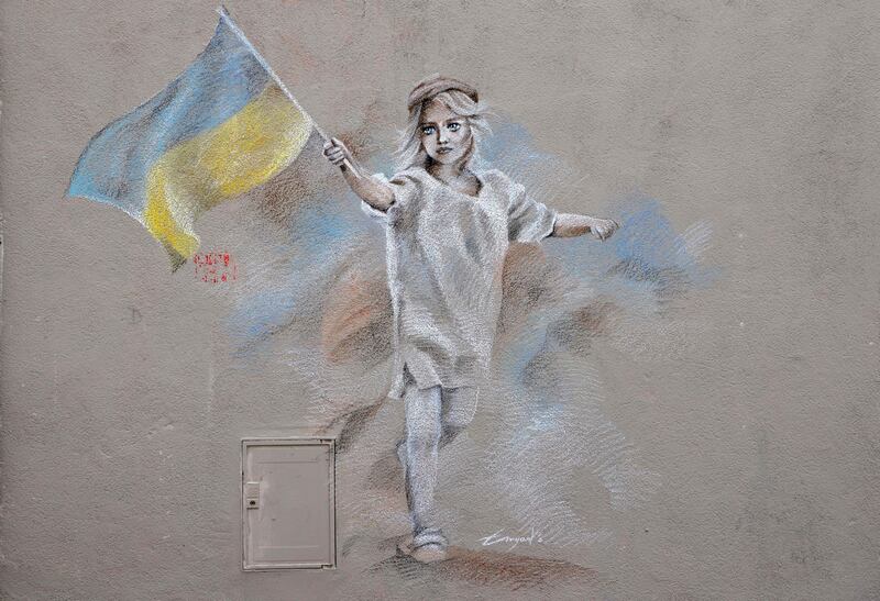 A street art painting by French artist Emyart dedicated to the Ukranian people. AFP