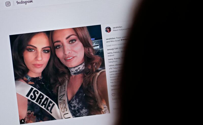 A picture taken on November 21, 2017 shows a picture posted by the Instagram profile of Sarah Idan on November 14, who holds the titles of "Miss Iraq USA 2016" and "Miss Iraq Universe 2017", as she is seen taking a "selfie" photograph with Adar Gandelsman, who holds the title of "Miss Universe Israel 2017", with a caption reading: "Peace and Love from Miss Iraq and Miss Israel #missuniverse".
The post has been "liked" over 3,600 times since it was first uploaded but it also triggered an avalanche of comments, some positive and others negative in Iraq, which does not recognize the Jewish state and is still technically in a state of war with it. Both contestants defended the post saying they wanted to share a message of peace. / AFP PHOTO / THOMAS COEX / RESTRICTED TO EDITORIAL USE - MANDATORY MENTION OF THE ARTIST UPON PUBLICATION - TO ILLUSTRATE THE EVENT AS SPECIFIED IN THE CAPTION