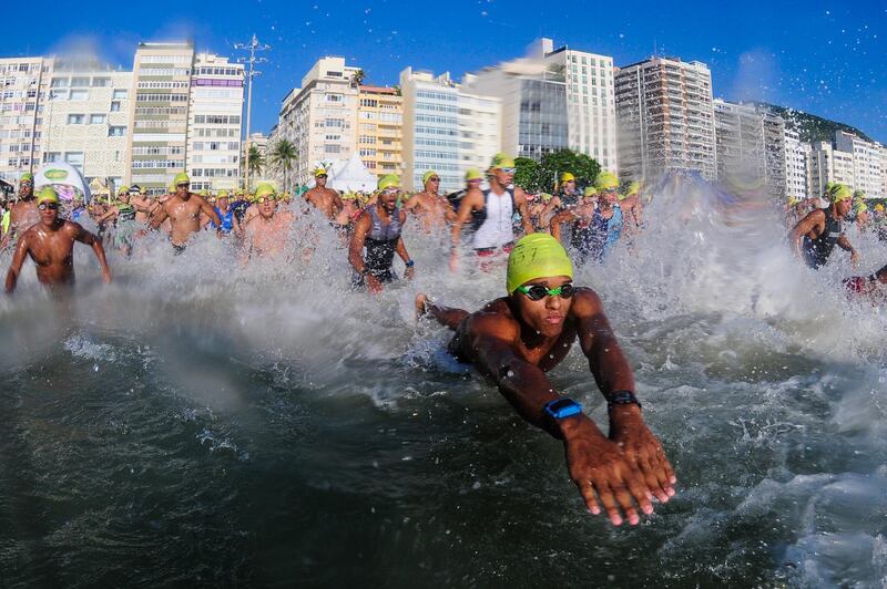 Athletes start the men's open-water-swimming competition during the Rei e Rainha do Mar at Copacabana beach in Rio de Janeiro, Brazil. Getty